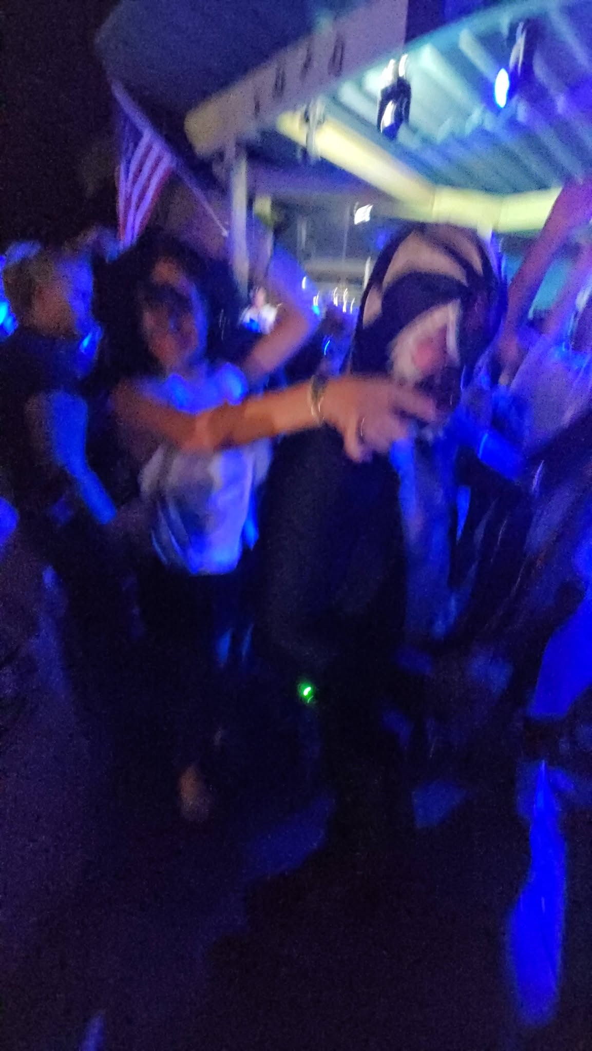 Leo's view of the blue-lit crowd dancing at Salt Shack