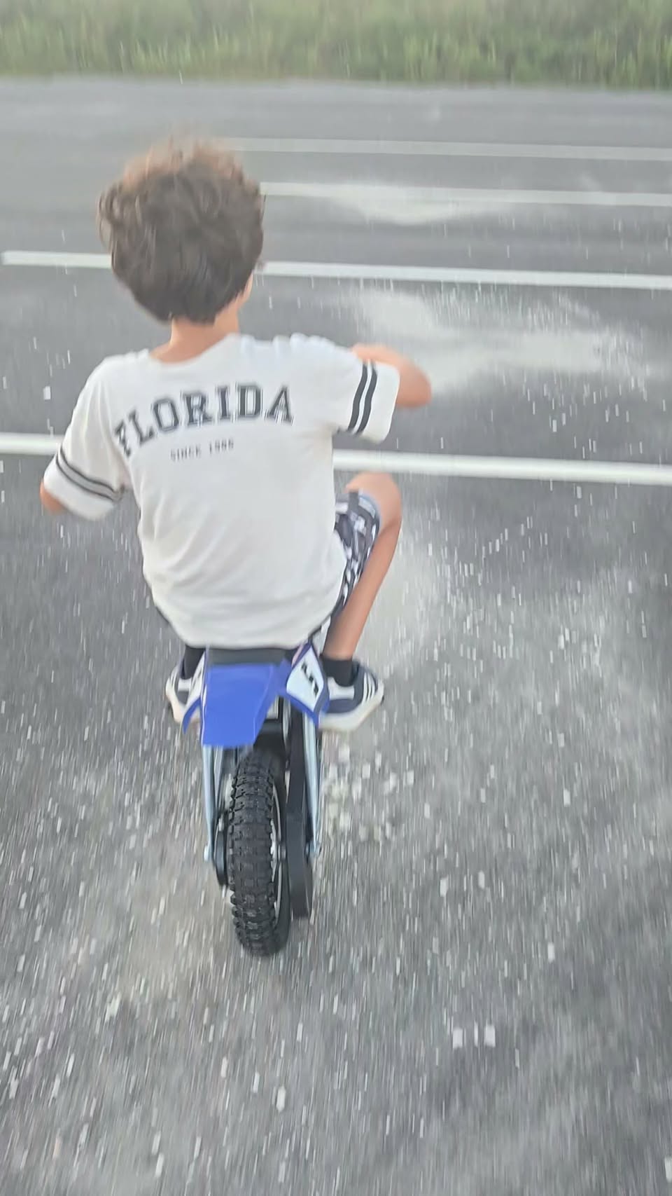 A rider on a small motorbike in a frame from Leo's public Boat Yard reel